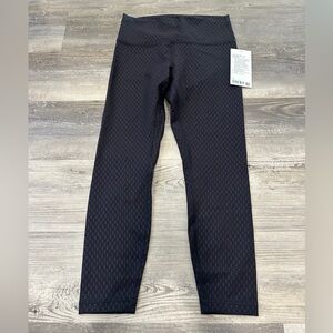 NEW with tags!! Lululemon Wunder Train High-Rise Tight 25"
Geo Tile Emboss Black